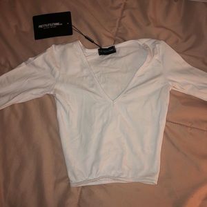 White cropped long sleeve top